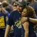 Michigan sophomore Trey Burke's parents, Benji and Ronda Burke embrace in the stands as Michigan leaves the court after losing national championship, 82-76, to Louisville at the Georgia Dome in Atlanta on Monday, April 8, 2013. Melanie Maxwell I AnnArbor.com